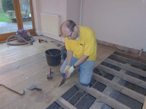 Cutting tongue and groove floorboards with a floorboard saw