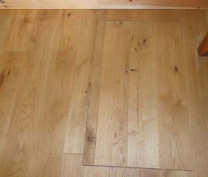 The access hatch in the oak floor was installed at the same time as the oak floor