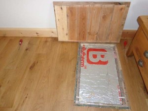 Access hatch with cover removed showing PIR thermal insulation board