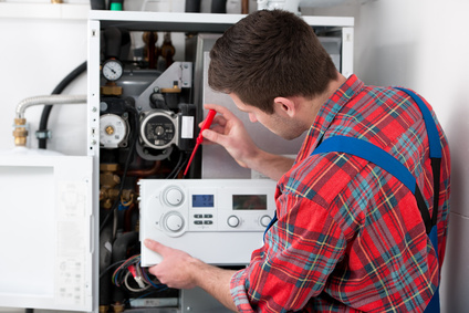 Engineer doing a gas boiler service